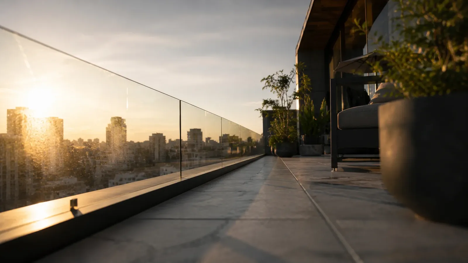 The terrace with a glass balustrade and city views