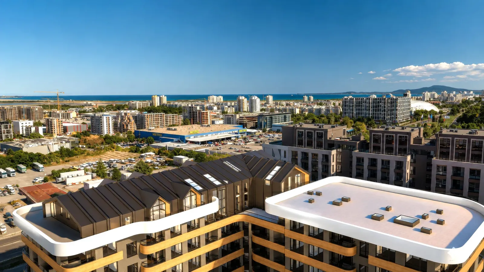 Buildings with mansard roofs and a view to the sea